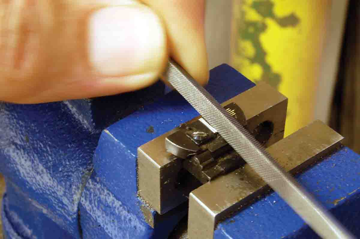 Filing the groove for white paint in the rear of a Lyman folding sight blade.